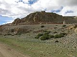 Tibet Kailash 06 Tirthapuri 05 Looking up to Pass at top of Kora It takes about an hour to walk Tirthapuri's own short kora. From the bank of the Sutlej, heres a view looking up towards the pass at the top of the kora with mani walls below.